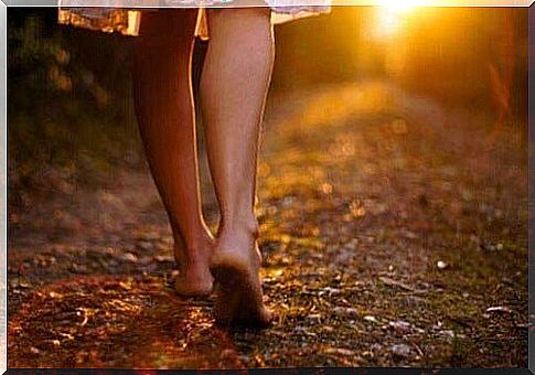 Woman walks barefoot