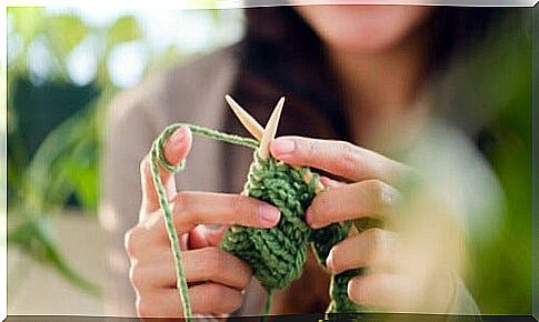 Woman works crochet