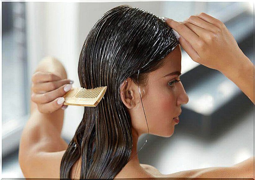 Woman combing her hair with yogurt