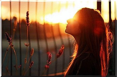 Girl watches the sunset