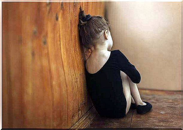 Autism, little girl sitting in the corner