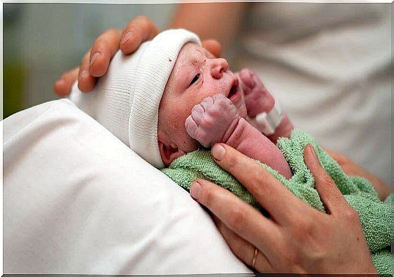 Newborn baby with white hat