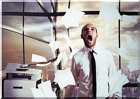 Stressed office worker between sheets flying through the air.