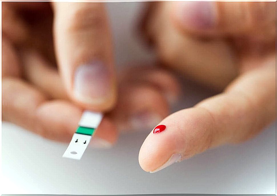 Finger with blood drop and test strip