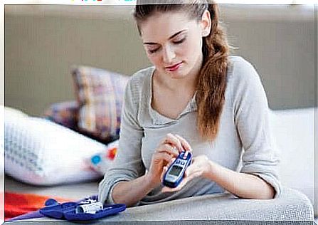 Woman measuring blood sugar.