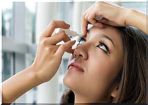 Girl putting eye drops