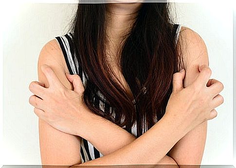 Girl with long hair and crossed arms