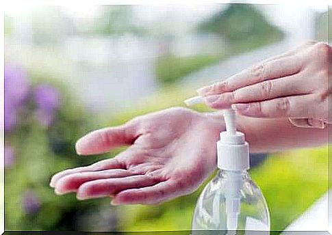 Hands and bottle of liquid soap