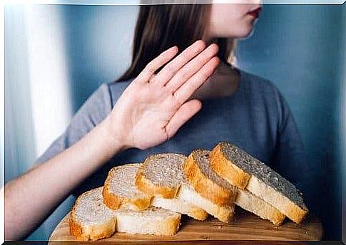 Girl pushes away the bread with her hand